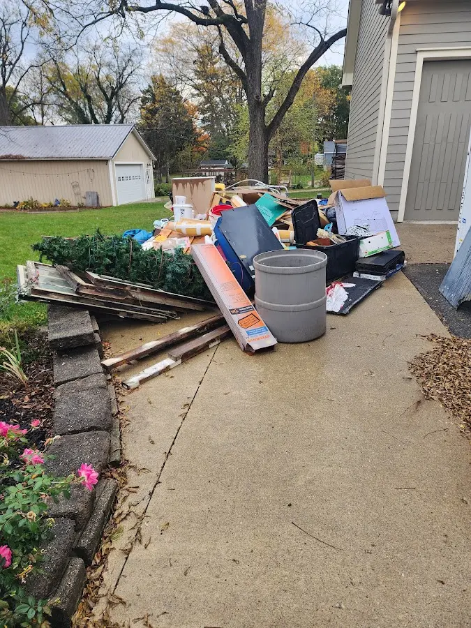 Dumpster being loaded with debris for 30 Yard Dumpster Rental in Caruthersville